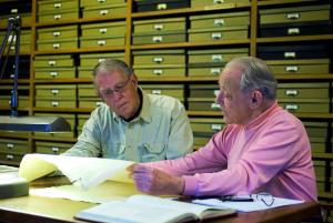 Stephen Tracy (left) and Christian Habicht (right) examine a squeeze in the Institute’s collection.