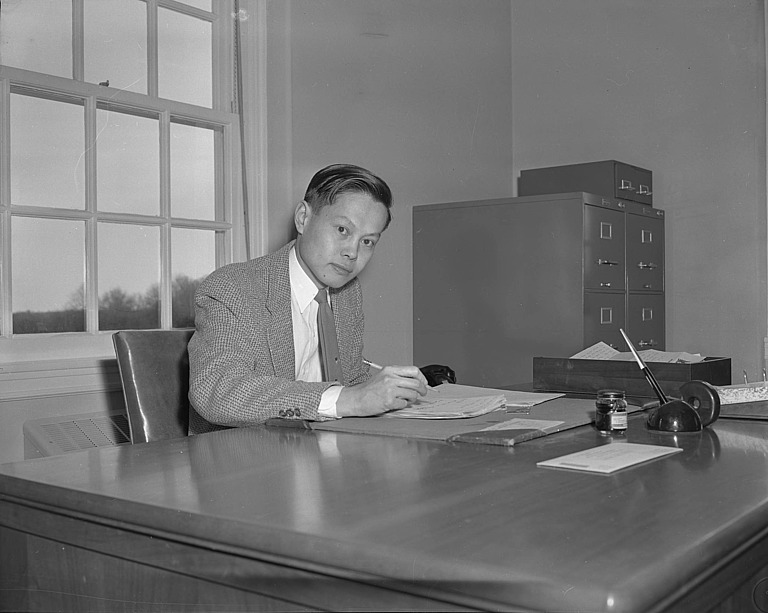 Chen Ning Yang seated at his desk at IAS