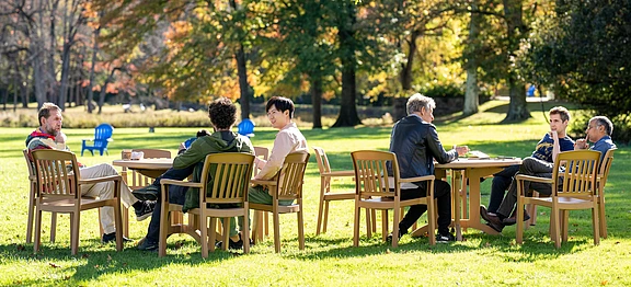 Scholars in conversation on IAS campus grounds