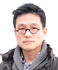 Juhn Young Ahn headshot