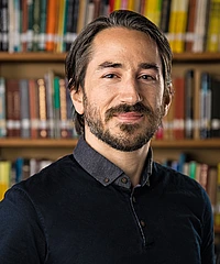 Tankut Can headshot