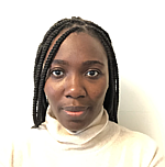 A headshot of Kara Yacoubou Djima.  She is wearing a cream-color turtleneck and standing in front of a white backdrop.