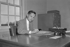 Chen Ning Yang seated at his desk at IAS