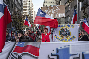 Demonstrators protest against the constitutional process during a meeting of the Constitutional Convention outside the former Chilean National Congress in Santiago, Chile, on Wednesday, June 7, 2023.