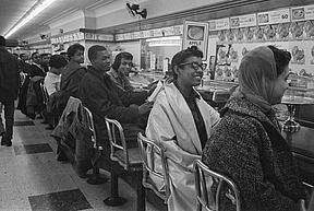 On February 13, 1960, students line the counter of a dime store in Greensboro, North Carolina, in protest of the store’s refusal to serve them.