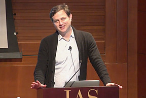 Benjamin Greenbaum talks at the podium in Wolfensohn Hall at the Institute for Advanced Study