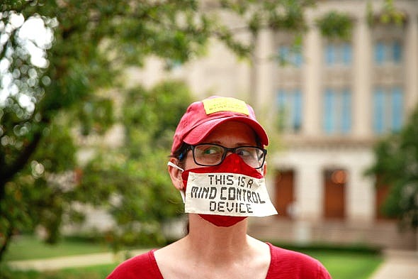A woman wears a mask during an anti-mask rally in Indianapolis on July 19, 2020.