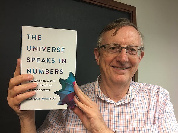 Graham Farmelo poses with his book "The Universe Speaks in Numbers"