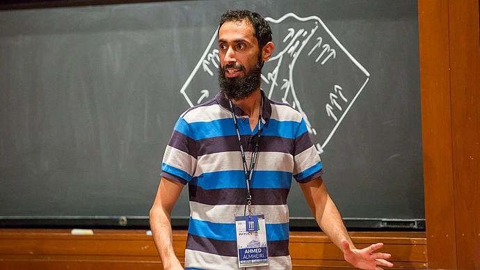 Ahmed Almheiri speaks on the stage at Wolfensohn Hall at the Institute for Advanced Study
