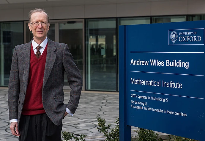 Andrew Wiles outside the Institute of Mathematics at Oxford University, named in his honor.
