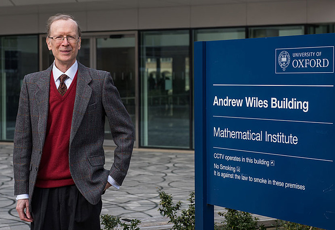 Andrew Wiles outside the Institute of Mathematics at Oxford University, named in his honor.
